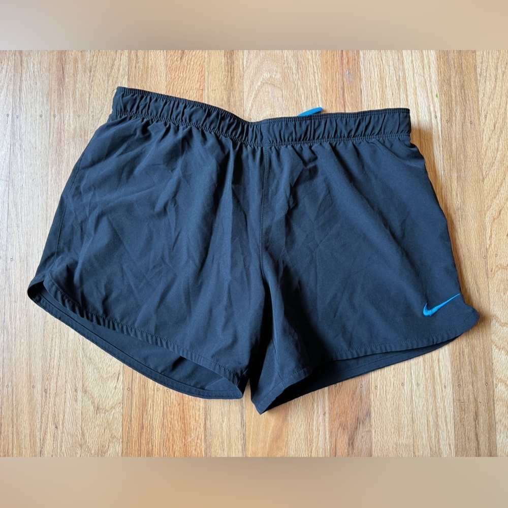 Nike Women's Black Athletic Shorts with Blue Swoosh